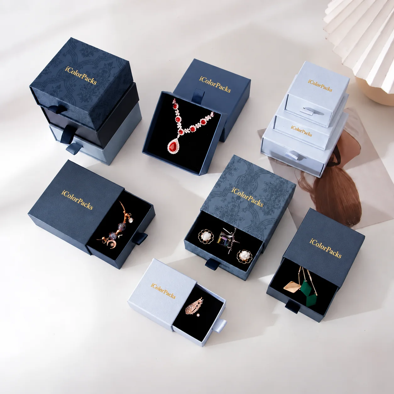 Coordinated blue and silver-blue jewelry rigid box collection for rings earrings and necklaces